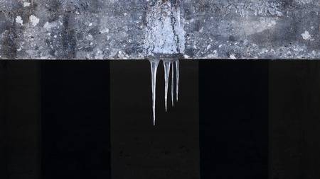 icicles hanging from the roof close upの写真素材