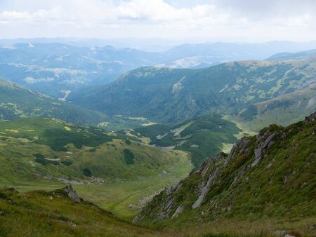 Mountain valley during sunrise / sunset. Natural summer landscape. Colorful summer landscape in the Carpathian mountains.の写真素材