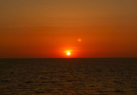Rising sun over the sea in the morningの写真素材