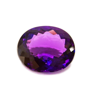 Single violet amethyst gem on white backgroundの写真素材