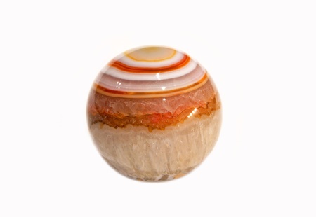Polished striped natural agate ball on white backgroundの写真素材
