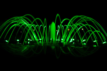 Close view details of the fountain at night, green lighting decorationの写真素材