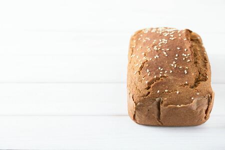 Homemade baked spelled bread on a wooden background.Horizontal photo.の写真素材