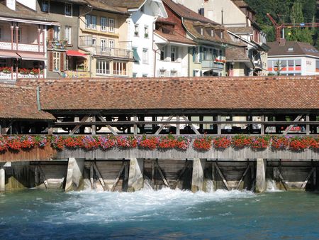 Ancient dam and wooden bridge in Thun, Switzerlandの写真素材