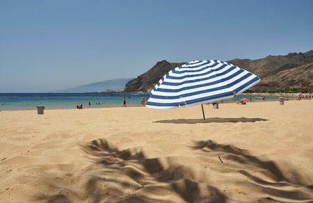 Striped umbrella on the Teresitas beach of Tenerife island. Canaries の写真素材