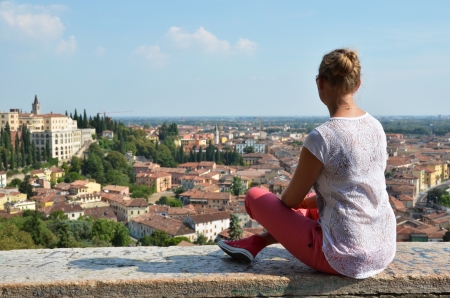 Girl looking to Verona town, Italyの写真素材