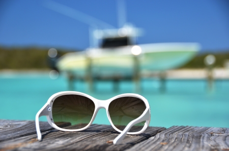 Sunglasses on the wooden jettyの写真素材