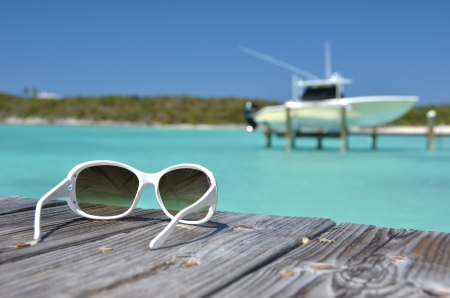 Sunglasses on the wooden pier. Great Exuma, Bahamasの写真素材