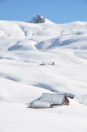 Farm house buried under snow, Melchsee-Frutt, Switzerland の写真素材