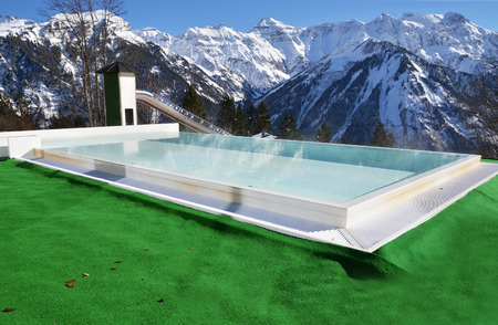 Swimming pool agains snowy Alpsのeditorial素材