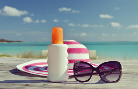 Hat, sunglasses and sun lotion. Exuma, Bahamas