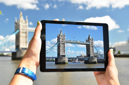 Tower bridge on the screen of a tabletの写真素材