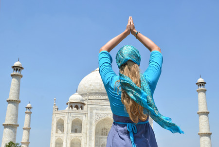 Young woman meditating atTaj Mahal. Agra, Indiaの写真素材