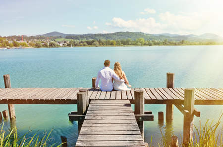 A couple on the wooden jetty at the lake. Switzerlandの写真素材