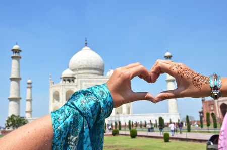 Heart-shaped hands against Taj Mahal. Agra, Indiaの写真素材