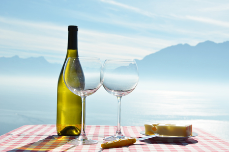 Wine and cheese against Geneva lake, Switzerlandの写真素材
