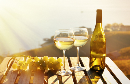 Wine and grapes against Geneva lake, Switzerlandの写真素材