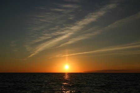 The sun sets behind the horizon. Black Sea.の写真素材