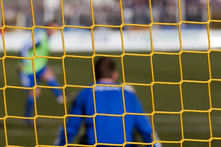 Football soccer goal net with grass backgroundの写真素材