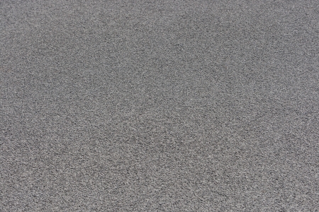 Grey tartan athletic running track on the stadium  Tartan track is the trademarked all-weather synthetic track surfacing for athletics made of polyurethaneの写真素材