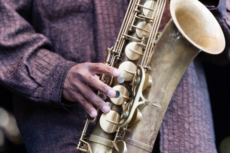 Hand and Saxophone of a musicianの写真素材
