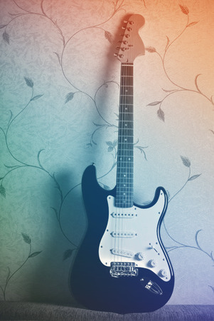 electric guitar on wall backgroundの写真素材