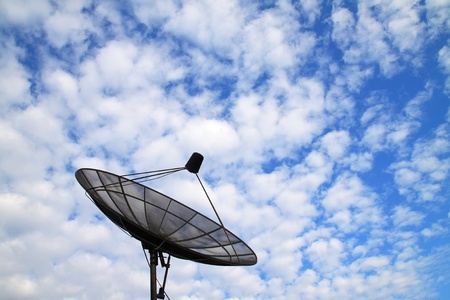 satellite dish with clouds and blue skyの写真素材