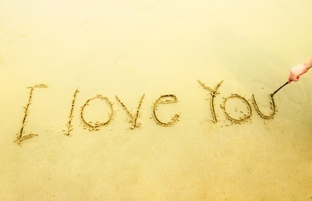 Hand writing I love you on sand and beachの写真素材