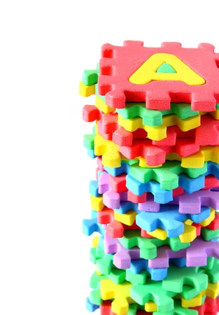 colorful alphabet puzzle mat isolated with spaceの写真素材