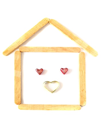 wood ice-cream stick in shape as a house with heartの写真素材