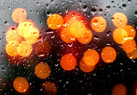 Rain Drops on window with bokeh effect の写真素材