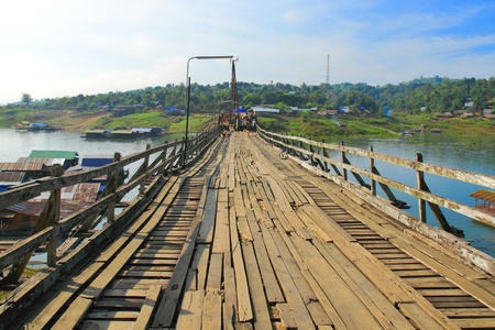 handmade wood bridge with Burmese workers in Sangkhlaburi, Thailand 