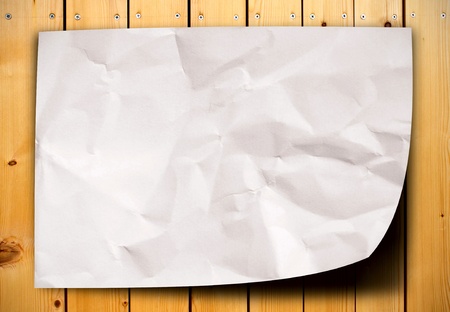 blank crumpled paper on wood tableの写真素材