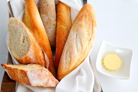 Sliced baguette with butterの写真素材