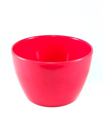 Pink empty plastic bowl isolated on whiteの写真素材
