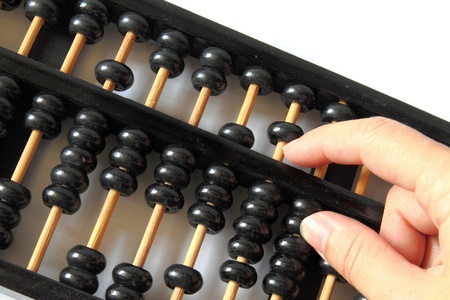 hand and a wooden abacus with copy space