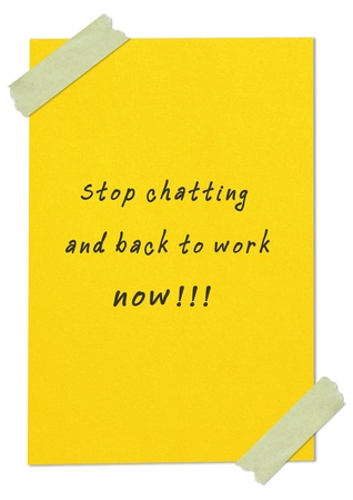 message"stop chatting and back to work now" writing on yellow paperの写真素材