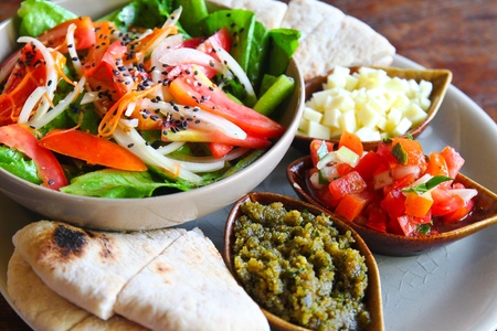 mediterrenean salad with cheese and breadの写真素材