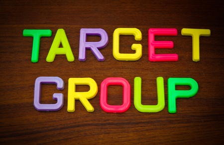Target group in colorful toy letters on wood backgroundの写真素材
