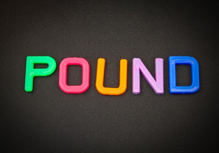 Pound in colorful toy letters on black backgroundの写真素材