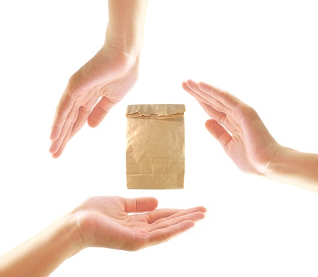 Female hands with paper bag in recycle concept の写真素材