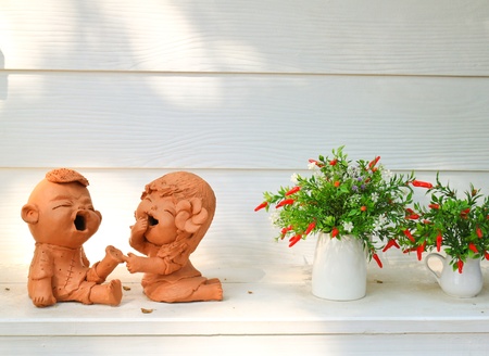 Doll clay and flower in ornamental gardenの写真素材
