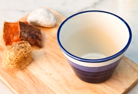 empty cup on chopping boardの写真素材