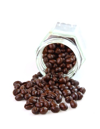 Coffee beans in a glass jar on white backgroundの写真素材