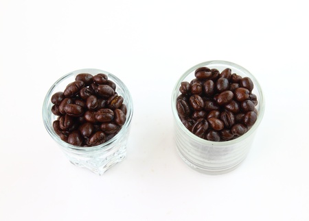 Coffee beans in glasses on white backgroundの写真素材
