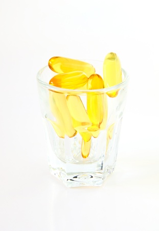 vitamins in glass on white backgroundの写真素材