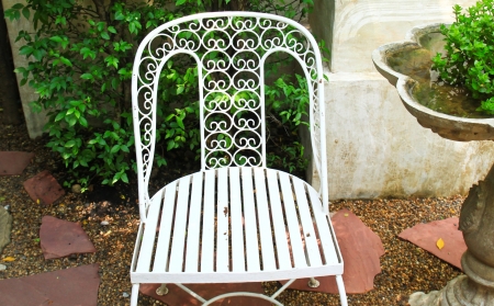 White chair in the gardenの写真素材