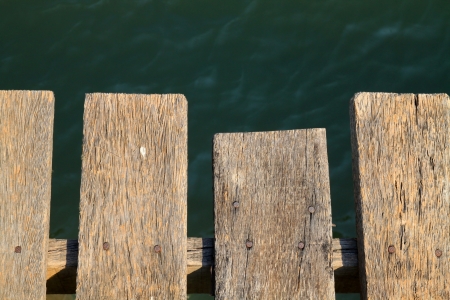 Wooden grunge floor above the riverの写真素材