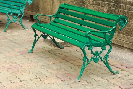 Green bench in the parkの写真素材