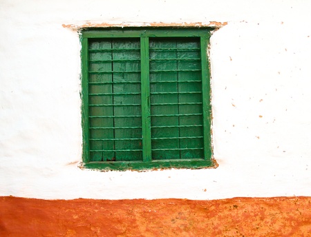 Old color wooden window on wallの写真素材